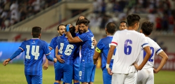 Kuwait's players celebrate scoring a goal