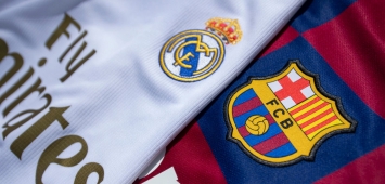 شعاري برشلونة وريال مدريد (Getty)