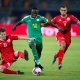 التونسيين بن محمد والسخيري في صراع على الكرة مع السنغالي ساديو ماني في نصف نهائي كأس أفريقيا 2019(Getty)