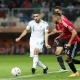 الجزائري أحمد قندوسي (يسار) في مباراة منتخب بلاده ضد ليبيا في افتتاح شان 2022 (Getty) ون ون winwin