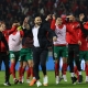 نجوم المغرب بقيادة المدرب وليد الركراكي يحتفلون بالفوز التاريخي على البرازيل (Getty) ون ون winwin