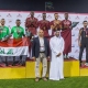 نجوم من المنتخب القطري لألعاب القوى على منصة التتويج (twitter/QNA_Sports)